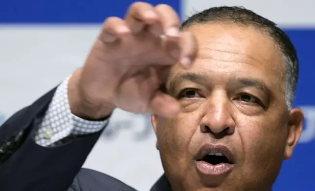 Los Angeles Dodgers manager Dave Roberts attends a press conference on the commercials he appears Wednesday, Dec. 4, 2024, in Tokyo. (AP Photo/Eugene Hoshiko)