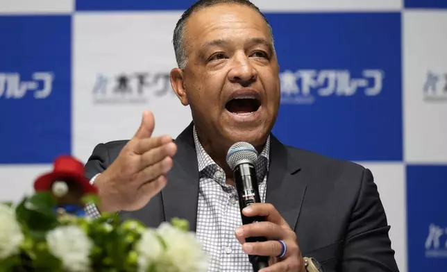 Los Angeles Dodgers manager Dave Roberts attends a press conference on the commercials he appears Wednesday, Dec. 4, 2024, in Tokyo. (AP Photo/Eugene Hoshiko)