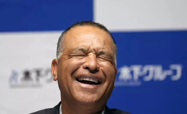 Los Angeles Dodgers manager Dave Roberts attends a press conference on the commercials he appears Wednesday, Dec. 4, 2024, in Tokyo. (AP Photo/Eugene Hoshiko)