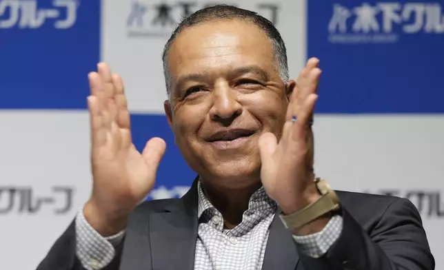 Los Angeles Dodgers manager Dave Roberts attends a press conference on the commercials he appears Wednesday, Dec. 4, 2024, in Tokyo. (AP Photo/Eugene Hoshiko)