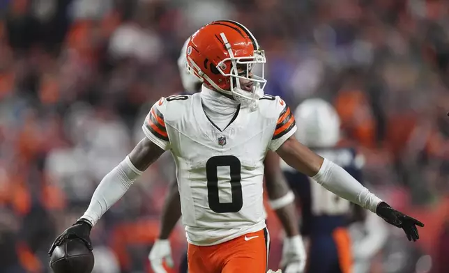 Cleveland Browns cornerback Greg Newsome II runs to the bench after intercepting a pass during the first half of an NFL football game against the Denver Broncos, Monday, Dec. 2, 2024, in Denver. (AP Photo/David Zalubowski)