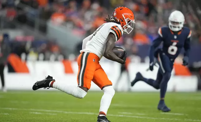 Cleveland Browns wide receiver Jerry Jeudy runs for a first down during the first half of an NFL football game against the Denver Broncos, Monday, Dec. 2, 2024, in Denver. (AP Photo/Jack Dempsey)