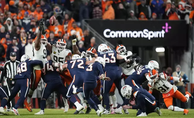 Denver Broncos place-kicker Wil Lutz (3) kicks a field goal during the second half of an NFL football game against the Cleveland Browns, Monday, Dec. 2, 2024, in Denver. (AP Photo/Jack Dempsey)