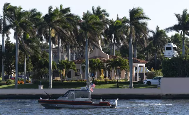 A Coast Guard patrol boat cruises near Mar-a-Lago, President-elect Donald Trump's Palm Beach home, in Palm Beach, Fla., Saturday, Dec. 21, 2024. (AP Photo/Manuel Balce Ceneta)