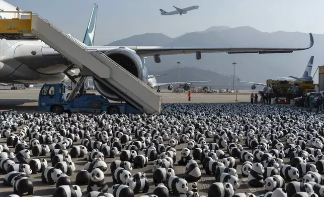 Part of 2500 panda sculptures are displayed at the Hong Kong International Airport during a welcome ceremony of the panda-themed exhibition "Panda Go!" in Hong Kong, Monday, Dec. 2, 2024. (AP Photo/Chan Long Hei)