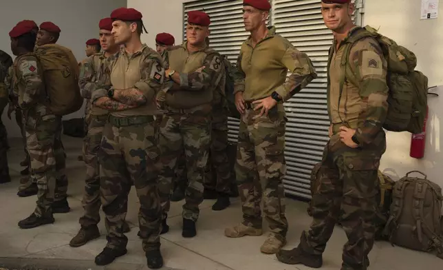 French troops arrive to give support Wednesday, Dec. 18, 2024 in the French Indian Ocean island of Mayotte. (AP Photo/Adrienne Surprenant)