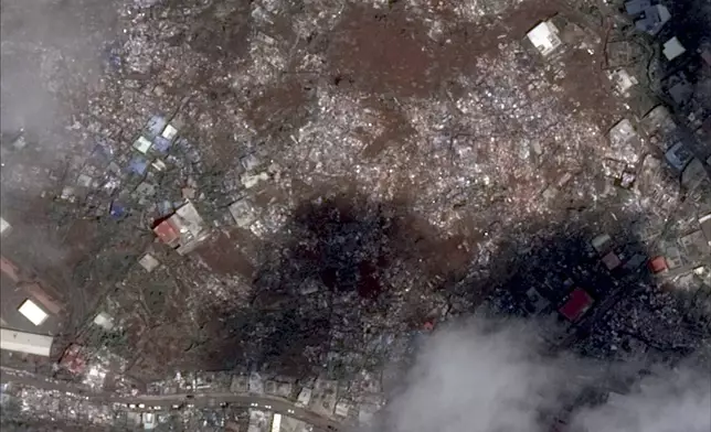 This satellite photo provided Wednesday Dec.18, 2024 by the Centre National d'Etudes Spatiales (CNES) shows Doujani in the Indian Ocean the French territory of Mayotte, on Dec. 15, 2024, after the cyclone Chido. (CNES distributed by Airbus DS via AP)