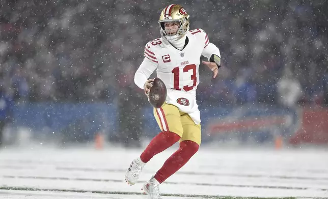 San Francisco 49ers quarterback Brock Purdy (13) looks to pass against the Buffalo Bills during the first half of an NFL football game in Orchard Park, N.Y., Sunday, Dec. 1, 2024. (AP Photo/Adrian Kraus)