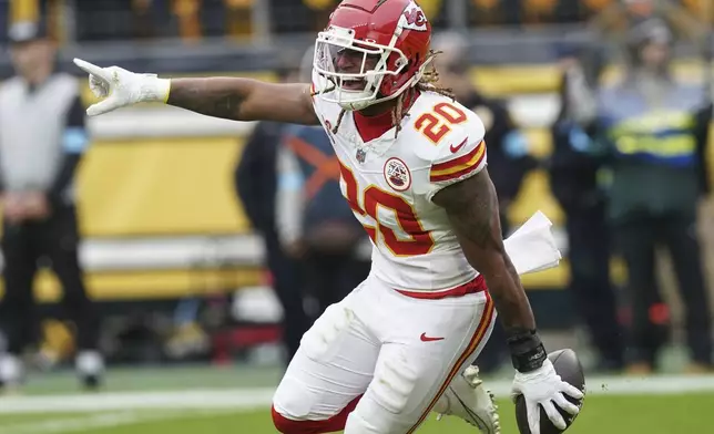 Kansas City Chiefs safety Justin Reid (20) celebrates his interception off Pittsburgh Steelers quarterback Russell Wilson during the first half of an NFL football game, Wednesday, Dec. 25, 2024, in Pittsburgh. (AP Photo/Matt Freed)