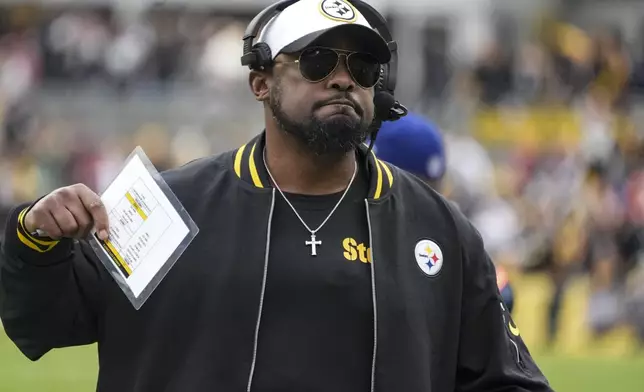 Pittsburgh Steelers head coach Mike Tomlin walks the sidelines during the first half of an NFL football game against the Kansas City Chiefs, Wednesday, Dec. 25, 2024, in Pittsburgh. (AP Photo/Gene J. Puskar)