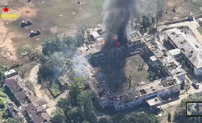 This video grab released by the Arakan Army shows burning buildings in the headquarters of the army's western command in Ann township, Rakhine state, Myanmar, Dec. 17, 2024. (The Arakan Army via AP)