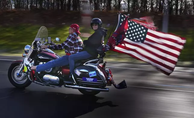 Bikers show their support for President-elect Donald Trump while riding on I-84, Wednesday, Nov. 6, 2024, near Lords Valley, Pa. (AP Photo/Robert F. Bukaty)