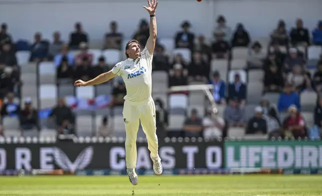 New Zealand's Nathan Smith reaches up to field the ball during play on day one of the second cricket test between New Zealand and England at the Basin Reserve in Wellington, New Zealand, Friday, Dec.6, 2024. (Andrew Cornaga/Photosport via AP)