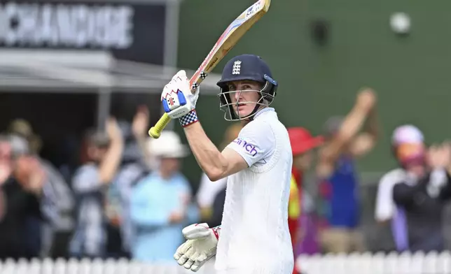 England's Harry Brook gestures to the crowd as he leaves the field after he was dismissed during play on day one of the second cricket test between New Zealand and England at the Basin Reserve in Wellington, New Zealand, Friday, Dec.6, 2024. (Kerry Marshall/Photosport via AP)