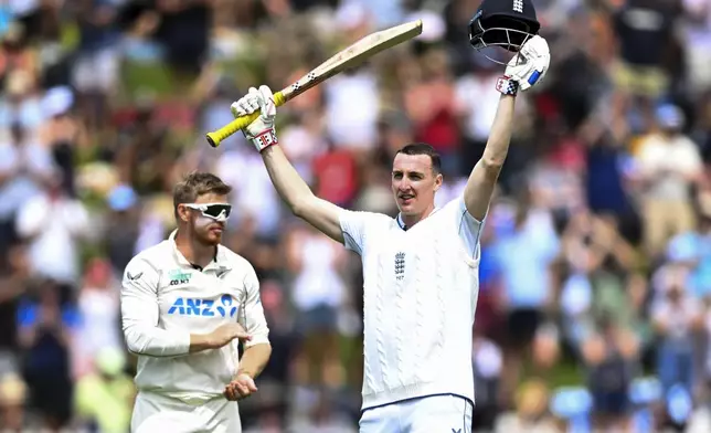 England's Harry Brook celebrates after scoring a century during play on day one of the second cricket test between New Zealand and England at the Basin Reserve in Wellington, New Zealand, Friday, Dec.6, 2024. (Kerry Marshall/Photosport via AP)