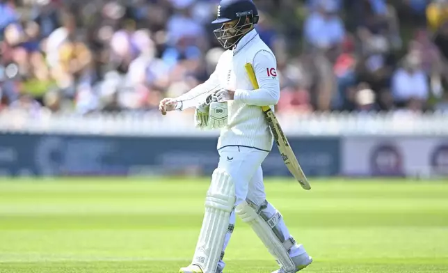 England's Ben Duckett walks from the field after he was dismissed during play on day one of the second cricket test between New Zealand and England at the Basin Reserve in Wellington, New Zealand, Friday, Dec.6, 2024. (Andrew Cornaga/Photosport via AP)