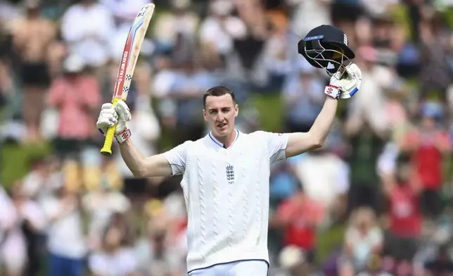 England's Harry Brook celebrates after scoring a century during play on day one of the second cricket test between New Zealand and England at the Basin Reserve in Wellington, New Zealand, Friday, Dec.6, 2024. (Kerry Marshall/Photosport via AP)