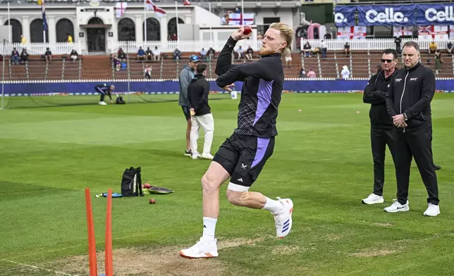 England captain Ben Stokes warms up ahead of play in the second cricket test between New Zealand and England at the Basin Reserve in Wellington, New Zealand, Friday, Dec.6, 2024. (Andrew Cornaga/Photosport via AP)