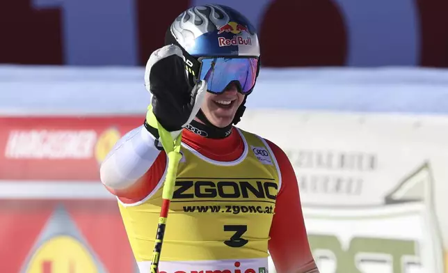 Switzerland's Franjo von Allmen reacts after completing an alpine ski, men's World Cup downhill race, in Bormio, Italy, Saturday, Dec. 28, 2024. (AP Photo/Marco Trovati)