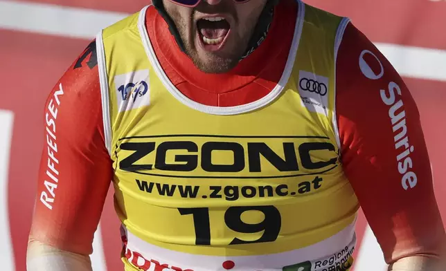 Switzerland's Alexis Monney reacts after completing an alpine ski, men's World Cup downhill race, in Bormio, Italy, Saturday, Dec. 28, 2024. (AP Photo/Marco Trovati)