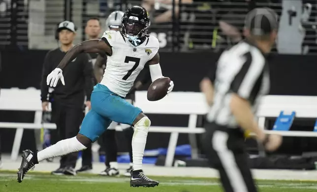 Jacksonville Jaguars wide receiver Brian Thomas Jr. runs to the end zone for a touchdown after making a catch against the Las Vegas Raiders during the second half of an NFL football game Sunday, Dec. 22, 2024, in Las Vegas. (AP Photo/John Locher)