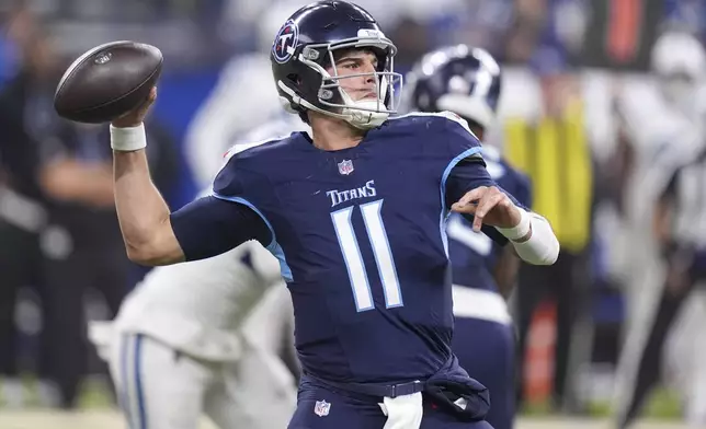 Tennessee Titans quarterback Mason Rudolph (11) looks to throw a pass during the first half of an NFL football game against the Indianapolis Colts, Sunday, Dec. 22, 2024, in Indianapolis. (AP Photo/Michael Conroy)