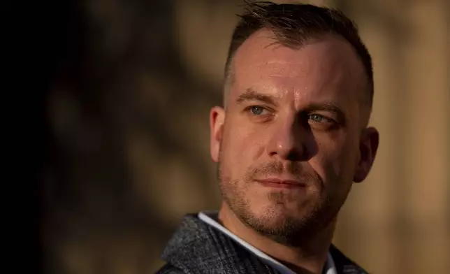 Recreational rugby player Sean McDowell, whose SafeSport case investigator Jason Krasley was fired after being arrested for stealing drug money in his previous job as a police officer, poses for a portrait Wednesday, Dec. 18, 2024, in Seattle. (AP Photo/Lindsey Wasson)