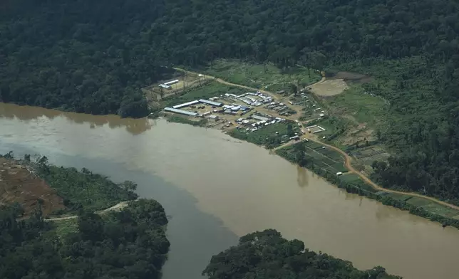 Discoloration is visible in a river near mining operations at the Muchacha mine in September 2022, near the Okapi Wildlife Reserve in Congo. (AP Photo)