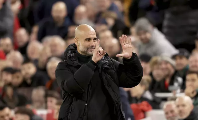 Manchester City's head coach Pep Guardiola puts up six fingers to remind the jeering fans of his six Premier League titles at the end of the English Premier League soccer match between Liverpool and Manchester City at Anfield Stadium, Liverpool, England, Sunday Dec. 1, 2024. (AP Photo/Ian Hodgson)