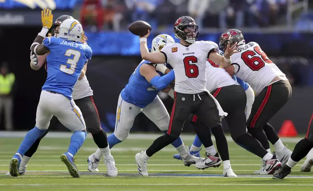 Tampa Bay Buccaneers quarterback Baker Mayfield (6) throws a pass during the first half of an NFL football game against the Los Angeles Chargers, Sunday, Dec. 15, 2024, in Inglewood, Calif. (AP Photo/Ryan Sun)