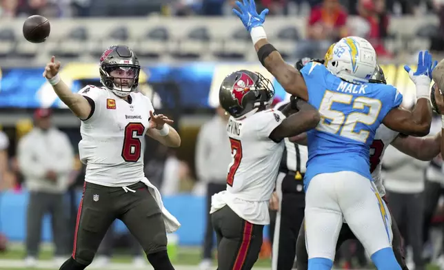 Tampa Bay Buccaneers quarterback Baker Mayfield (6) throws a pass during the second half of an NFL football game against the Los Angeles Chargers, Sunday, Dec. 15, 2024, in Inglewood, Calif. (AP Photo/Eric Thayer)