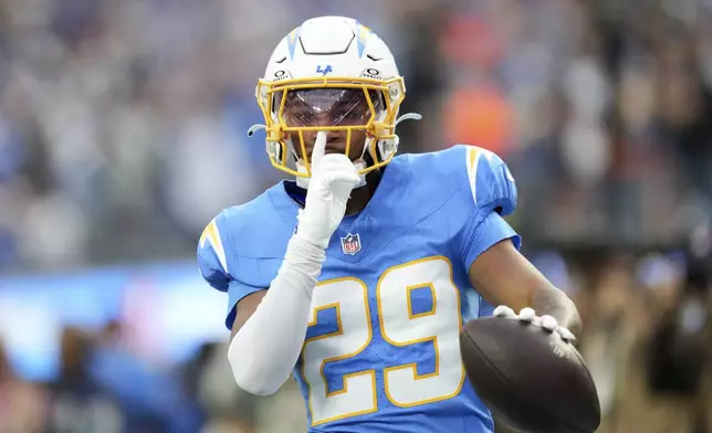 Los Angeles Chargers cornerback Tarheeb Still (29) celebrates after intercepting a pass during the first half of an NFL football game against the Tampa Bay Buccaneers, Sunday, Dec. 15, 2024, in Inglewood, Calif. (AP Photo/Eric Thayer)