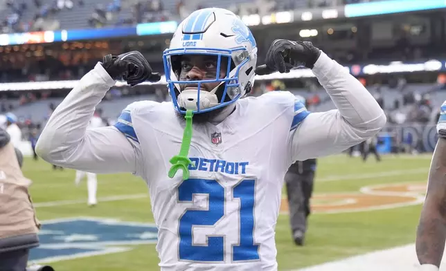 Detroit Lions cornerback Amik Robertson celebrates the team's 34-17 win over the Chicago Bears in an NFL football game Sunday, Dec. 22, 2024, in Chicago. (AP Photo/Erin Hooley)