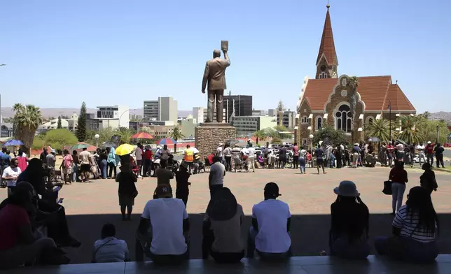 Namibians queue to cast their votes in presidential elections in Windhoek, Namibia, Wednesday, Nov. 27, 2024. (AP Photo/Dirk Heinrich)