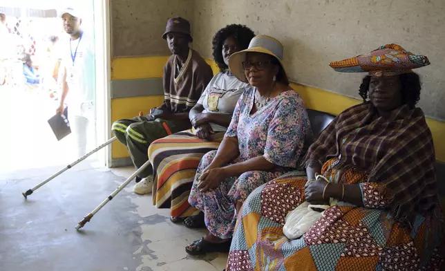 Namibians queue to cast their votes in a presidential election in Windhoek, Namibia Wednesday, Nov. 27, 2024. (AP Photo/Dirk Heinrich)