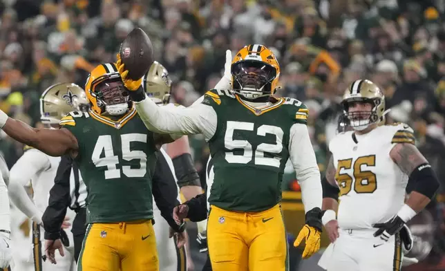 Green Bay Packers defensive end Rashan Gary (52) celebrates a fumble recovery during the first half of an NFL football game against the New Orleans Saints, Monday, Dec. 23, 2024, in Green Bay, Wis.(AP Photo/Morry Gash)