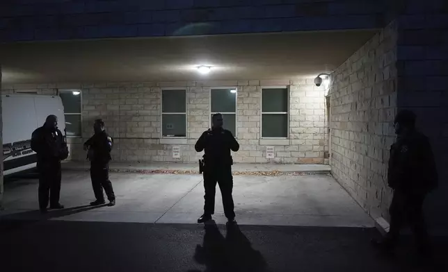 Police officers wait for the arrival of Luigi Nicholas Mangione at Blair County Courthouse in Hollidaysburg, Pa., Thursday, Dec. 19, 2024. (AP Photo/Gene J. Puskar, Pool)