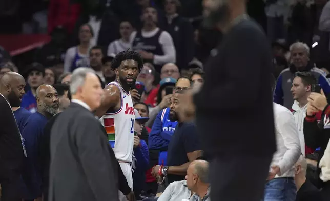 Philadelphia 76ers' Joel Embiid glares after being ejected by official Jenna Schroeder during the first half of an NBA basketball game against the San Antonio Spurs, Monday, Dec. 23, 2024, in Philadelphia. (AP Photo/Matt Slocum)