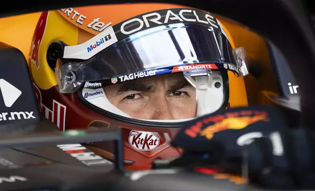 FILE - Red Bull Racing driver Sergio Perez, of Mexico, sits in his car during the first practice session at the Canadian Grand Prix in Montreal, Friday, June 16, 2023. (Paul Chiasson/The Canadian Press via AP, File)