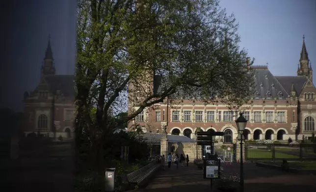 FILE - The Peace Palace housing the World Court, or International Court of Justice, is reflected in a monument in The Hague, Netherlands, Wednesday, May 1, 2024. (AP Photo/Peter Dejong, File)