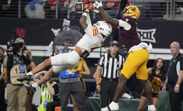 Iowa State defensive back Jeremiah Cooper (4) breaks up a pass intended for Arizona State wide receiver Xavier Guillory (1) in the second half of the Big 12 Conference championship NCAA college football game, in Arlington, Texas, Saturday Dec. 7, 2024. (AP Photo/Julio Cortez)