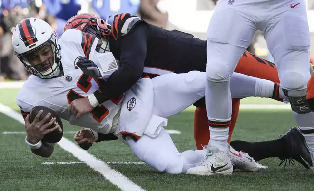 Cincinnati Bengals defensive end Trey Hendrickson (91) sacks Cleveland Browns quarterback Dorian Thompson-Robinson (17) during the first half of an NFL football game, Sunday, Dec. 22, 2024, in Cincinnati. (AP Photo/Joshua A. Bickel)