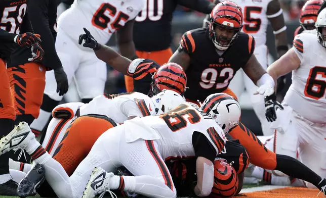 Cleveland Browns fumble the ball near the 1-yard line as Cincinnati Bengals safety Vonn Bell (24) recovers the fumble during the first half of an NFL football game, Sunday, Dec. 22, 2024, in Cincinnati. (AP Photo/Jeff Dean)