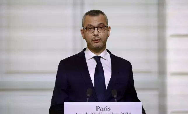 Alexis Kohler, Secretary-General of the Elysee Palace, announces the names of the ministers of the new cabinet, in the Elysee Palace, Monday, Dec 23, 2024 in Paris. French President Emmanuel Macron's office announced a new government, after the previous Cabinet collapsed in a historic vote prompted by fighting over France's budget. (Saboor Abdul/Pool via AP)