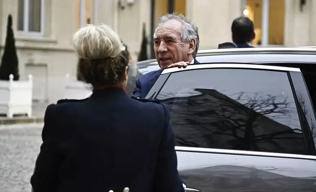 French Prime Minister Francois Bayrou arrives for a meeting at a crisis centre at the Interior Ministry in Paris, Monday Dec. 23, 2024, following the cyclone Chido's passage over the French Indian Ocean territory of Mayotte. French President Emmanuel Macron's office announced a new government Monday, after the previous Cabinet collapsed in a historic vote prompted by fighting over the country's budget. (Julien de Rosa, Pool via AP)