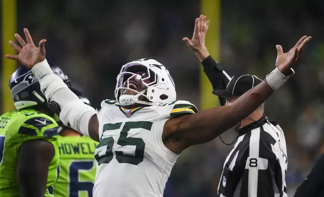 Green Bay Packers' Kingsley Enagbare reacts to a sack during the second half of an NFL football game against the Seattle Seahawks Sunday, Dec. 15, 2024, in Seattle. (AP Photo/Lindsey Wasson)