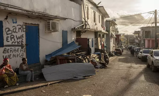 Cleared debris after Cyclone Chido are seen in the Kaweni slum on the outskirts of Mamoudzou, in the French Indian Ocean island of Mayotte, Thursday, Dec. 19, 2024. (AP Photo/Adrienne Surprenant)