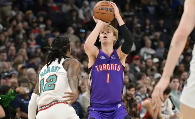 Toronto Raptors guard Gradey Dick (1) shoots against Memphis Grizzlies guard Ja Morant (12) in the first half of an NBA basketball game Thursday, Dec. 26, 2024, in Memphis, Tenn. (AP Photo/Brandon Dill)