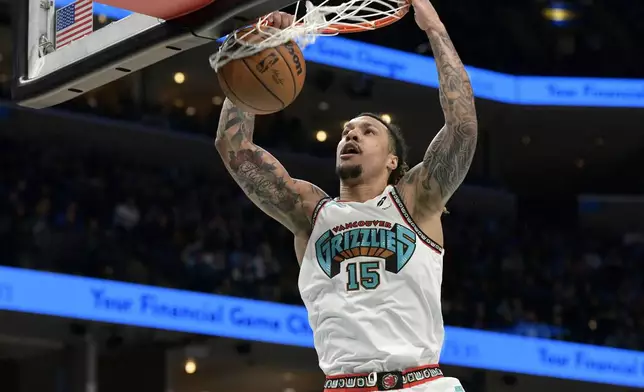 Memphis Grizzlies forward Brandon Clarke dunks in the second half of an NBA basketball game against the Toronto Raptors, Thursday, Dec. 26, 2024, in Memphis, Tenn. (AP Photo/Brandon Dill)