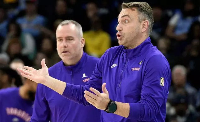 Toronto Raptors head coach Darko Rajakovic, right, reacts in the first half of an NBA basketball game against the Memphis Grizzlies, Thursday, Dec. 26, 2024, in Memphis, Tenn. (AP Photo/Brandon Dill)